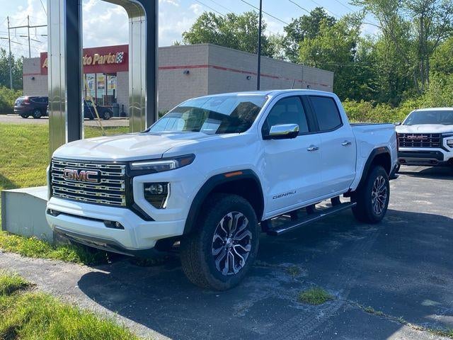 2026 GMC Canyon Denali in Summit White — front three-quarter view