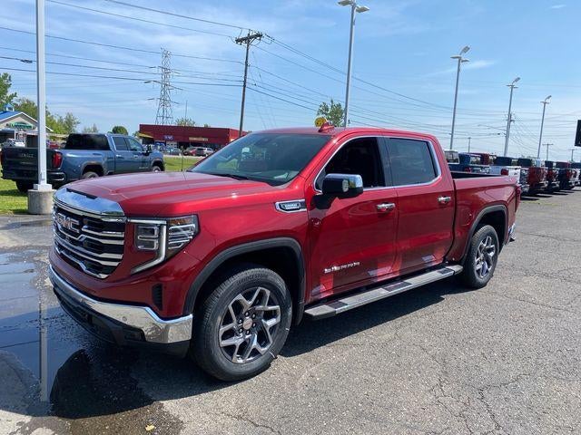2026 GMC Sierra 1500 SLT in Volcanic Red Tintcoat — front three-quarter view